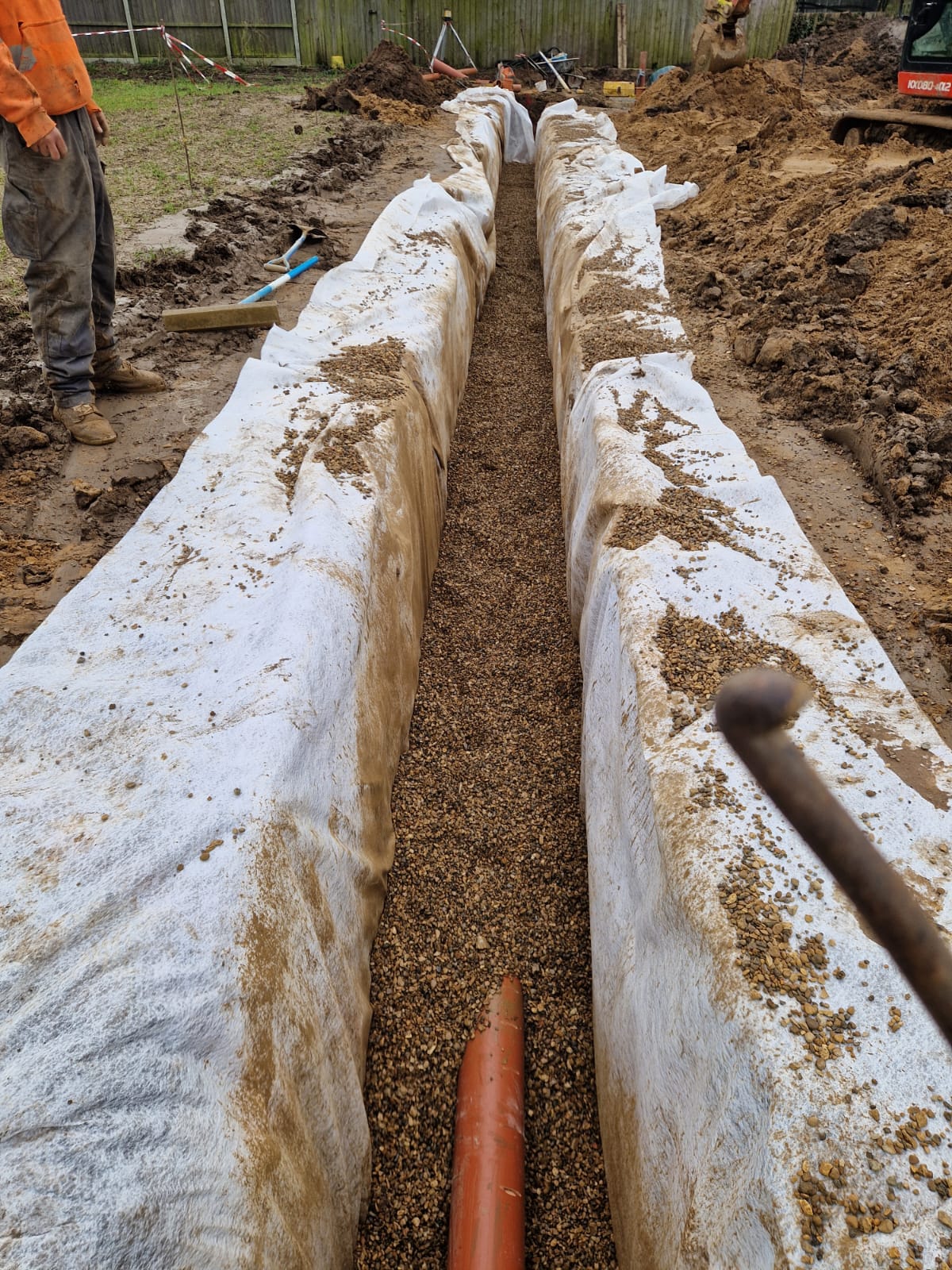 French drain trench excavated and lined with geotextile | groundworks and drainage in King's Lynn by Humphries Construction