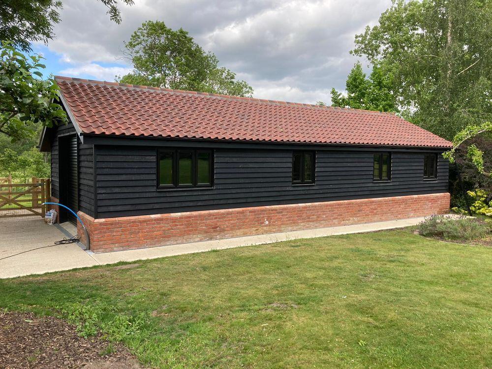 Completed garage conversion with black weatherboard cladding | garage conversions in King's Lynn by Humphries Construction