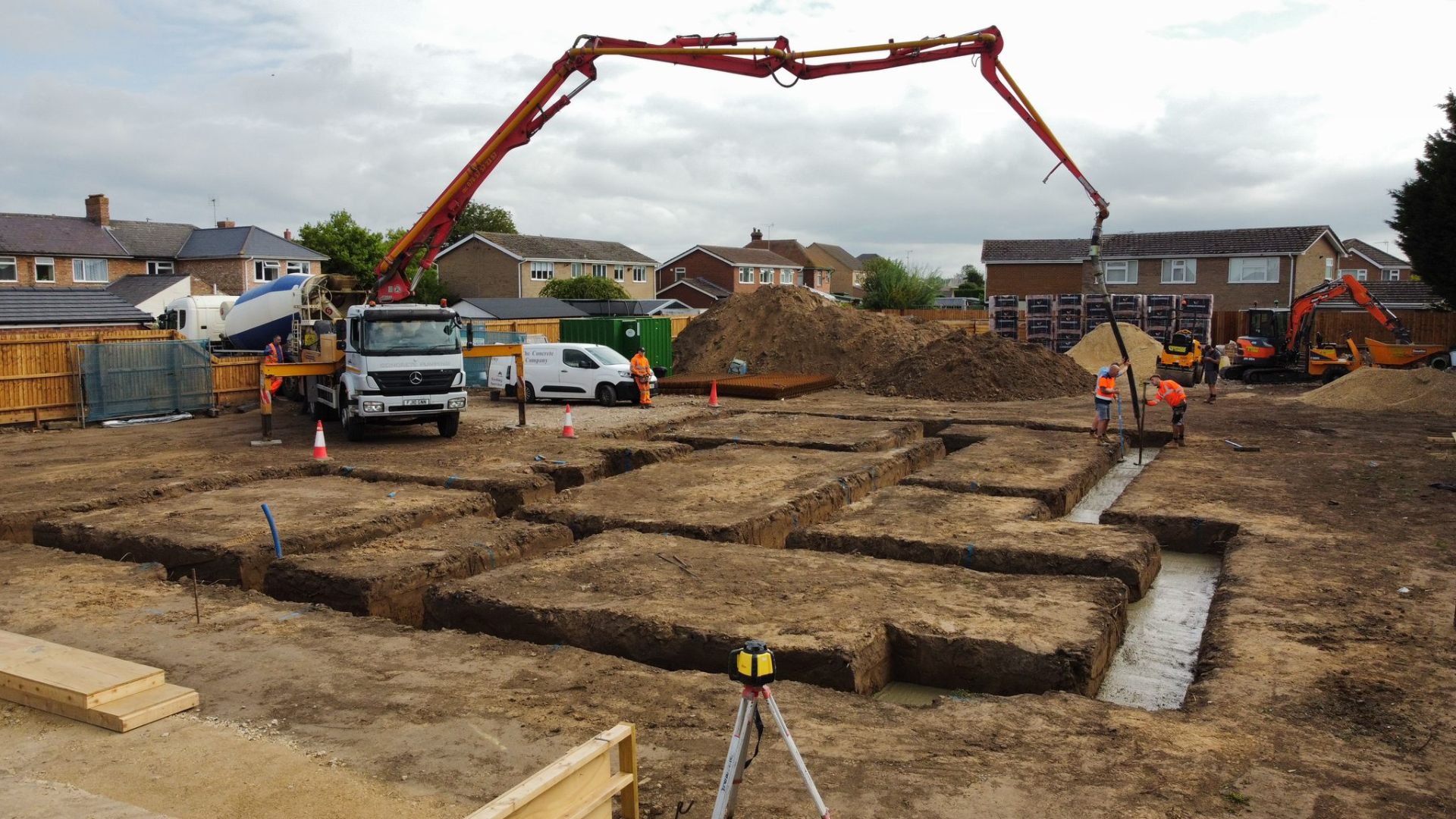 Concrete being pumped into new-build foundations on a Norfolk site by Humphries Construction